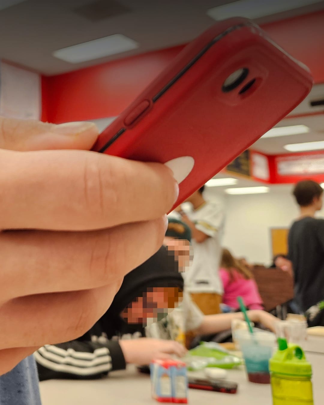 Teenager holding a smartphone